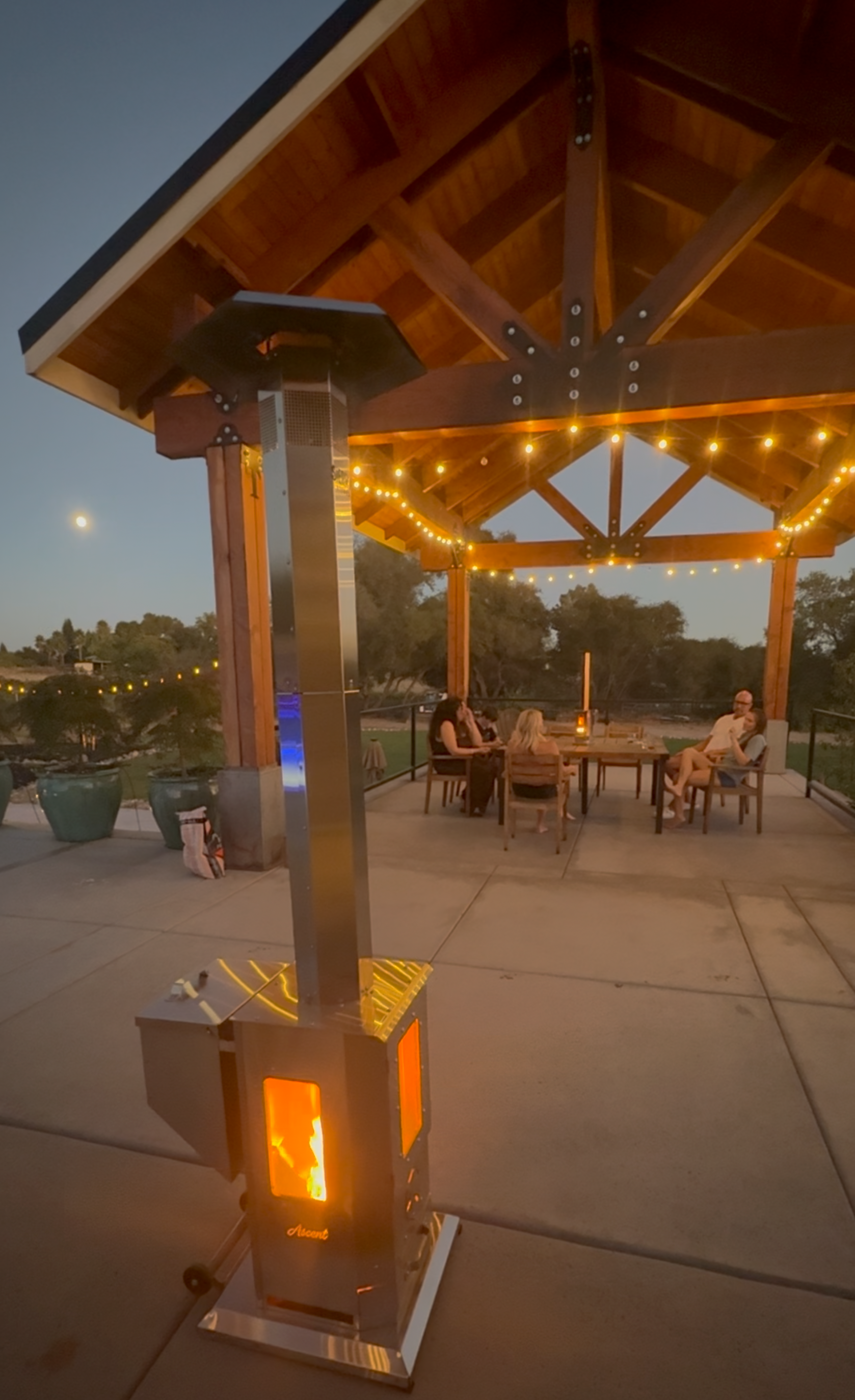 Sierra Trail™ glowing under a wooden pergola with string lights at dusk