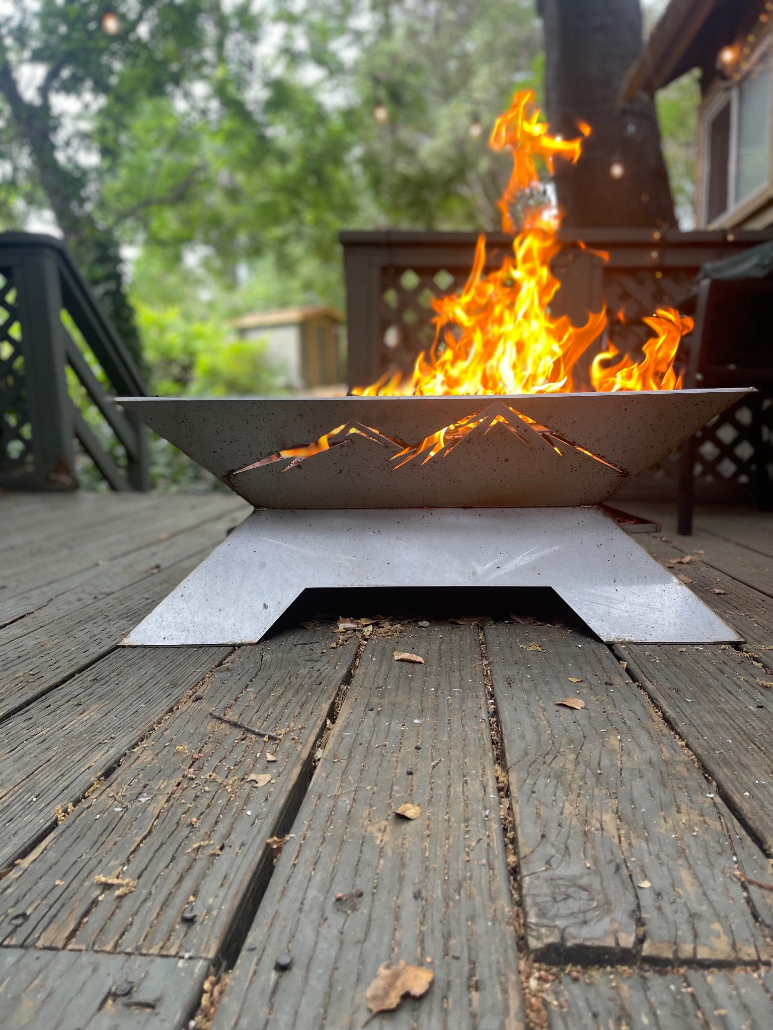 Sierra Ember™ CNC-cut mountain silhouette panels glowing with fire from inside